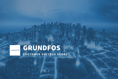 GRUNDFOS customer success story featuring an aerial view of a modern city skyline